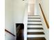 Beautiful wooden staircase leading to the upper level of the home at 436 Tavistock Dr, Mooresville, IN 46158