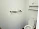 Bathroom featuring a toilet with a closed lid, a towel rack, and built-in storage at 436 Tavistock Dr, Mooresville, IN 46158