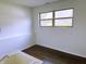 Bright utility room features a standard utility sink with tile countertop and hardwood floors at 436 Tavistock Dr, Mooresville, IN 46158