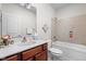 Cozy bathroom featuring a vanity with marble countertops and a combined shower and bathtub at 4557 Marigold Ct, Greenwood, IN 46143