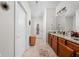 Full bathroom with tile flooring, a granite countertop, and wooden cabinets, offering both style and utility at 4557 Marigold Ct, Greenwood, IN 46143
