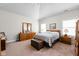 Cozy bedroom featuring a neutral decor, carpet, and ample natural light, offering a relaxing retreat at 4557 Marigold Ct, Greenwood, IN 46143