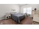 Serene bedroom with neutral walls, carpet flooring, and a window providing natural light at 4557 Marigold Ct, Greenwood, IN 46143