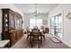 Elegant dining room with a chandelier, round table, and sliding glass doors, perfect for gatherings at 4557 Marigold Ct, Greenwood, IN 46143