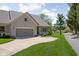 Beautiful brick home with well-maintained landscaping and a view of the surrounding greenery at 4557 Marigold Ct, Greenwood, IN 46143