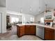 Open concept kitchen with stainless steel appliances and an adjacent dining area at 4557 Marigold Ct, Greenwood, IN 46143