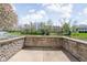 Stone patio overlooking a serene pond with fountain views at 4557 Marigold Ct, Greenwood, IN 46143