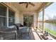 Cozy screened porch with brick, seating, and a serene view of the pond at 4557 Marigold Ct, Greenwood, IN 46143