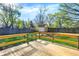A bright, sunny back deck overlooks the spacious backyard, complete with shed and privacy fence at 4775 E 56Th St, Indianapolis, IN 46220