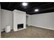 Finished basement space featuring a brick fireplace, recessed lighting, and carpet flooring at 4775 E 56Th St, Indianapolis, IN 46220