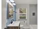 Updated bathroom features modern vanity, sleek fixtures, and updated bathtub with gray subway tile at 4775 E 56Th St, Indianapolis, IN 46220