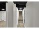 View of the hallway leading to carpeted stairs at 4775 E 56Th St, Indianapolis, IN 46220