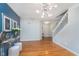 Dining area features hardwood floors, modern lighting, and stylish accents at 4917 Melbourne Rd, Indianapolis, IN 46228