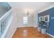 Dining area features hardwood floors, modern lighting, and stylish accents at 4917 Melbourne Rd, Indianapolis, IN 46228