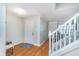 Inviting foyer features hardwood floors, staircase, and a neutral color palette at 4917 Melbourne Rd, Indianapolis, IN 46228