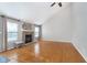 Spacious living room with a fireplace, hardwood floors, and ample natural light at 4917 Melbourne Rd, Indianapolis, IN 46228
