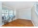 Bright living room with hardwood floors and built-in shelving beneath the windows at 4917 Melbourne Rd, Indianapolis, IN 46228