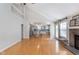Spacious living room with a fireplace, hardwood floors, and ample natural light at 4917 Melbourne Rd, Indianapolis, IN 46228