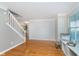 Bright living room with hardwood floors and built-in shelving beneath the windows at 4917 Melbourne Rd, Indianapolis, IN 46228