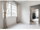 Bright room with white hexagon tile flooring, large window, and a walk-in closet at 5034 N Illinois St, Indianapolis, IN 46208