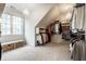 Spacious walk-in closet with custom shelving, chandelier lighting, and bench seating at 5034 N Illinois St, Indianapolis, IN 46208
