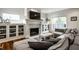 Inviting living room with a fireplace, custom built-ins, and comfortable seating with ample natural light at 5034 N Illinois St, Indianapolis, IN 46208