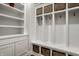 Mudroom area with custom shelving, storage baskets, and white cabinetry for organization at 5034 N Illinois St, Indianapolis, IN 46208