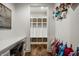 Mudroom features storage cubbies with baskets, a desk and hooks for hanging coats at 5034 N Illinois St, Indianapolis, IN 46208