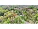 Aerial view of two homes situated in a wooded area with mature trees at 5212 Knollton Rd, Indianapolis, IN 46228