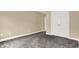 Neutral bedroom with carpet, closet and adjacent room at 5212 Knollton Rd, Indianapolis, IN 46228