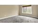 Bedroom featuring neutral walls, carpet, and a window with natural light at 5212 Knollton Rd, Indianapolis, IN 46228