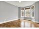 Bright bedroom features hardwood floors, neutral walls, and large bay windows with great natural light at 5212 Knollton Rd, Indianapolis, IN 46228