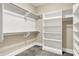 Spacious walk-in closet with built-in shelving and ample storage space for clothes and accessories at 5212 Knollton Rd, Indianapolis, IN 46228