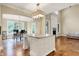 Open floor plan featuring a kitchen with center island, dining area, and living room at 5212 Knollton Rd, Indianapolis, IN 46228