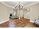 Open floor plan showcasing hardwood floors, chandelier, and living room with fireplace at 5212 Knollton Rd, Indianapolis, IN 46228