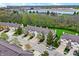 Aerial view of townhouses in a community with mature trees and manicured lawns at 5453 Nighthawk Way, Indianapolis, IN 46254