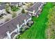 Aerial view of townhomes featuring private patios, lush lawns and mature trees at 5453 Nighthawk Way, Indianapolis, IN 46254