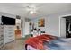 Spacious bedroom featuring neutral walls, ceiling fan, and an ensuite bathroom at 5453 Nighthawk Way, Indianapolis, IN 46254