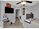 Bedroom featuring neutral paint, view to hallway, and a decorative ceiling fan at 5453 Nighthawk Way, Indianapolis, IN 46254