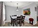 Cozy dining room with seating for six, neutral walls, and carpet flooring at 5453 Nighthawk Way, Indianapolis, IN 46254