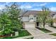 Charming townhouse with well-kept landscaping, driveway, and attached garage at 5453 Nighthawk Way, Indianapolis, IN 46254
