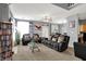 Spacious living room features comfortable furniture, decorative pillows, a glass coffee table, and neutral walls at 5453 Nighthawk Way, Indianapolis, IN 46254