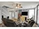 Bright living room with neutral walls, comfortable seating, fireplace, and a staircase at 5453 Nighthawk Way, Indianapolis, IN 46254