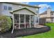 Screened-in porch offers a relaxing outdoor living space with comfortable seating at 5453 Nighthawk Way, Indianapolis, IN 46254
