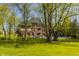 Expansive backyard with a pool, patio, and lush green lawn, perfect for outdoor living at 553 Bolderwood Ln, Carmel, IN 46032