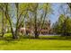 Large backyard with a swimming pool and patio, ideal for outdoor entertaining and relaxation at 553 Bolderwood Ln, Carmel, IN 46032