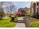 Beautiful home featuring meticulous landscaping, a walkway, and an attached garage at 553 Bolderwood Ln, Carmel, IN 46032