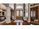Grand foyer featuring hardwood floors, high ceilings, decorative lighting, and a bench at 553 Bolderwood Ln, Carmel, IN 46032