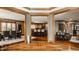 Open foyer with hardwood floors and views into the kitchen and living areas at 553 Bolderwood Ln, Carmel, IN 46032
