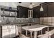 Modern outdoor kitchenette with stainless steel appliances, stylish cabinets, and unique backsplash tiles at 553 Bolderwood Ln, Carmel, IN 46032
